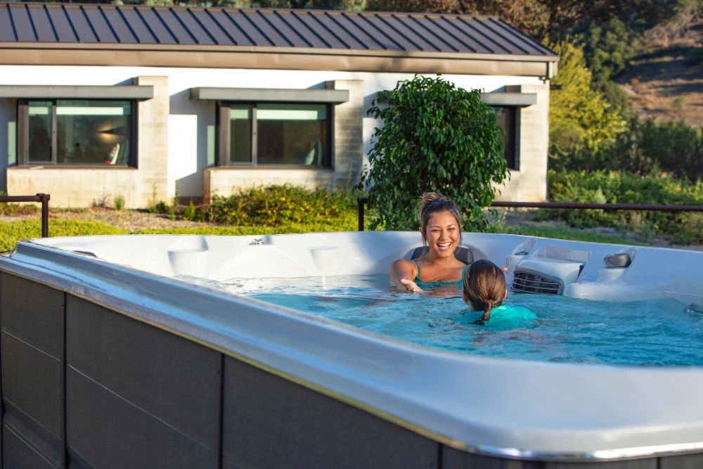 J16 PowerPro Jacuzzi Swim Spa with mother and daughter