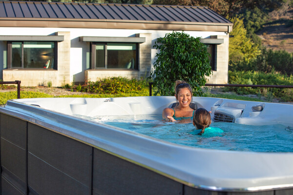 family enjoying their large swim spa