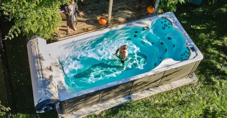 man standing on a swim spa swimlife swim spas